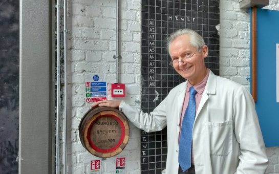 John Hatch stood in front of the donation box