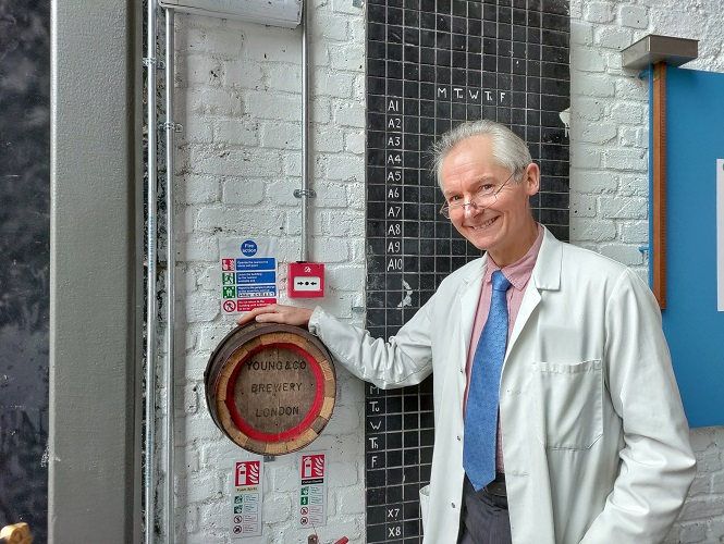 John Hatch stood in front of the donation box