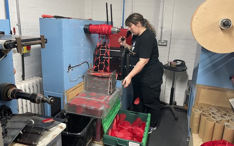 Nicola Stokes operates a poppy silk cutting machine.