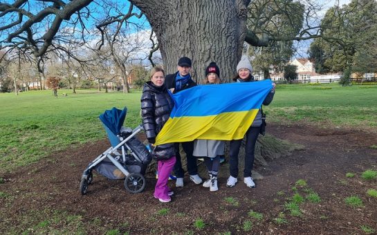 Ukranian nationals get together by the tree of peace