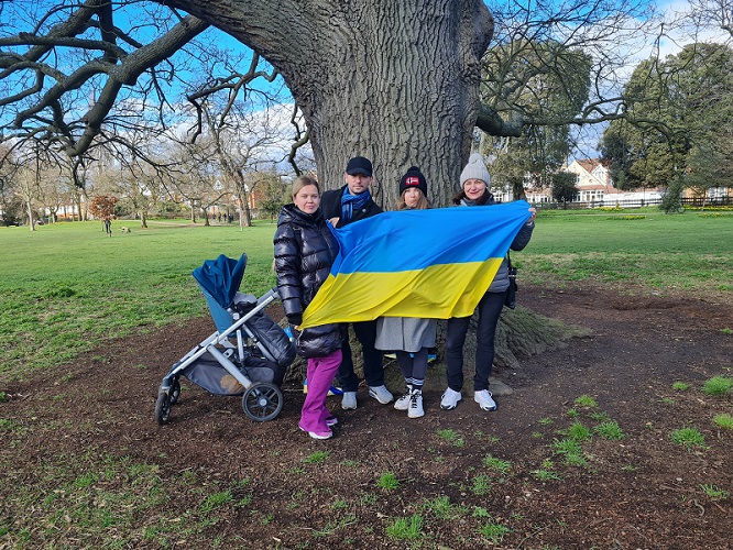 Ukranian nationals get together by the tree of peace