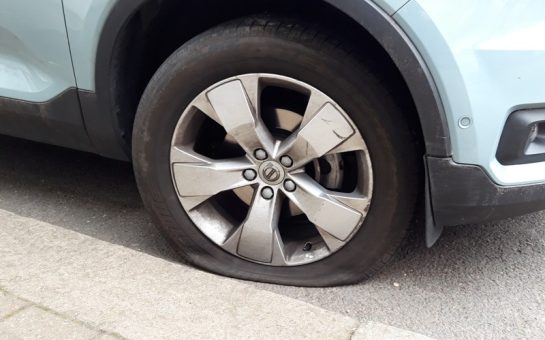 A car with a deflated tyre in Clapham