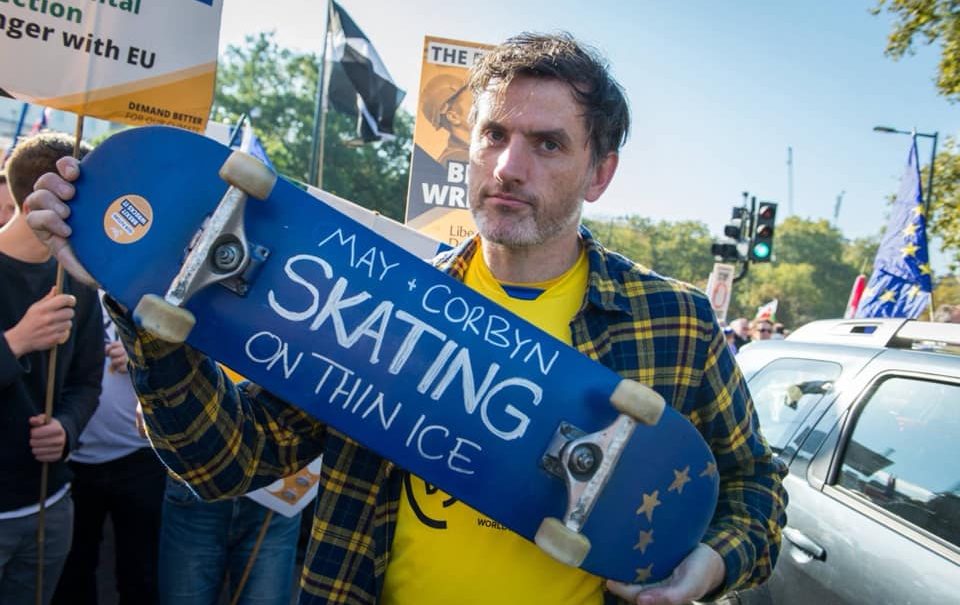 Councillor Jon Tolley holding a Skateboard