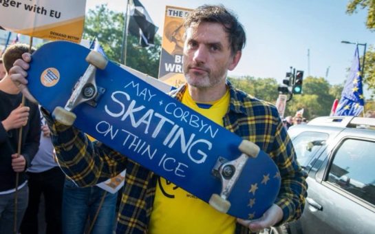 Councillor Jon Tolley holding a Skateboard