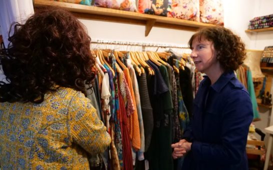 Labour MP Anneliese Dodds meeting a business owner in Tooting Market