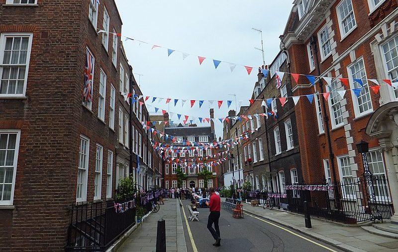 a street with flags and bunting up celebrating the diamond jubilee