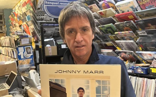 Photo of Jonny Marr holding his new album Fever Dreams 1-4