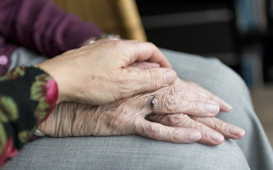 two people touching hands