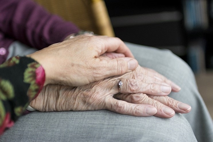 two people touching hands