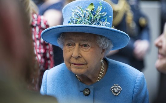 Photo of the Queen wearing blue hat and jacket