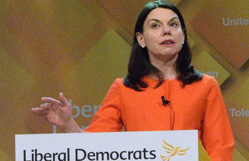 Sarah Olney MP speaking at Liberal Democrat lecturn