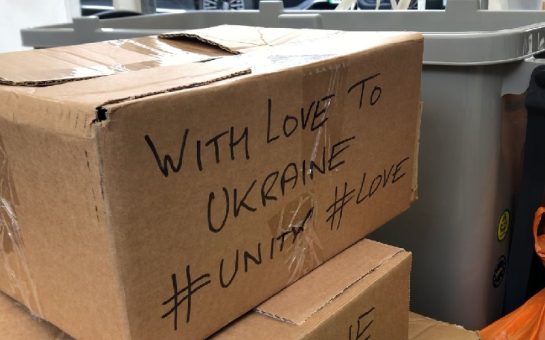 Food bank cardboard box with supportive Ukrainian message