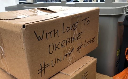 Food bank cardboard box with supportive Ukrainian message