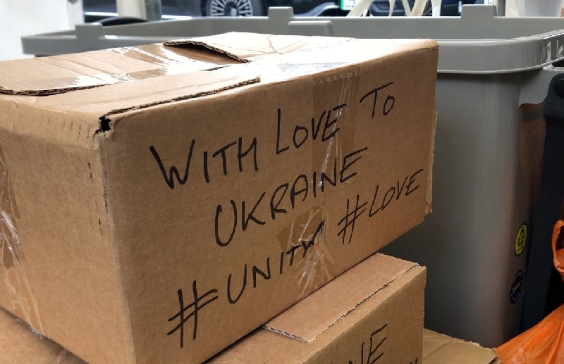 Food bank cardboard box with supportive Ukrainian message