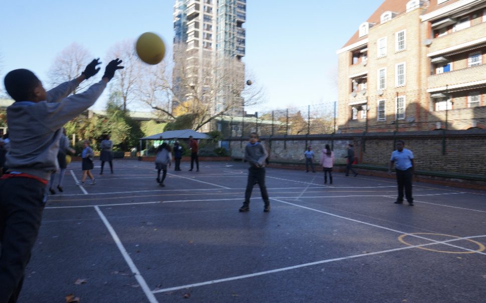 Children play volleyball, on School playground