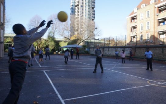 Children play volleyball, on School playground