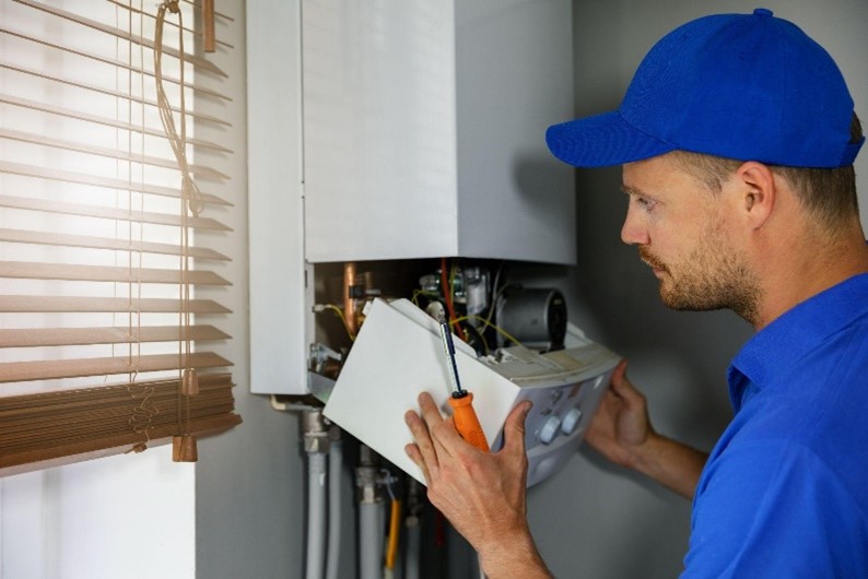 A man giving a boiler service