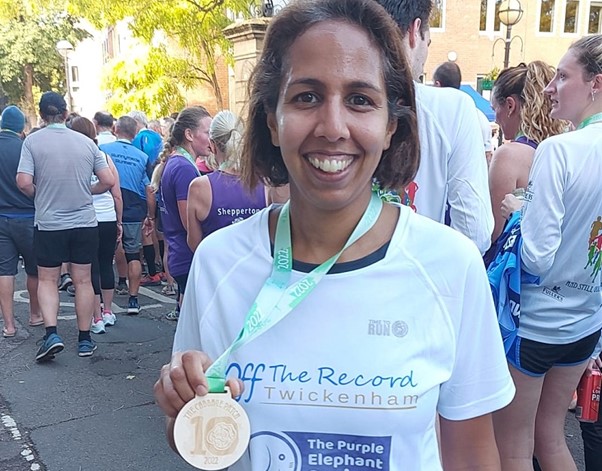 Twickenham MP, Munira Wilson, holding a medal