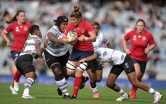 Shot of an England player carrying the ball during their match against Fiji