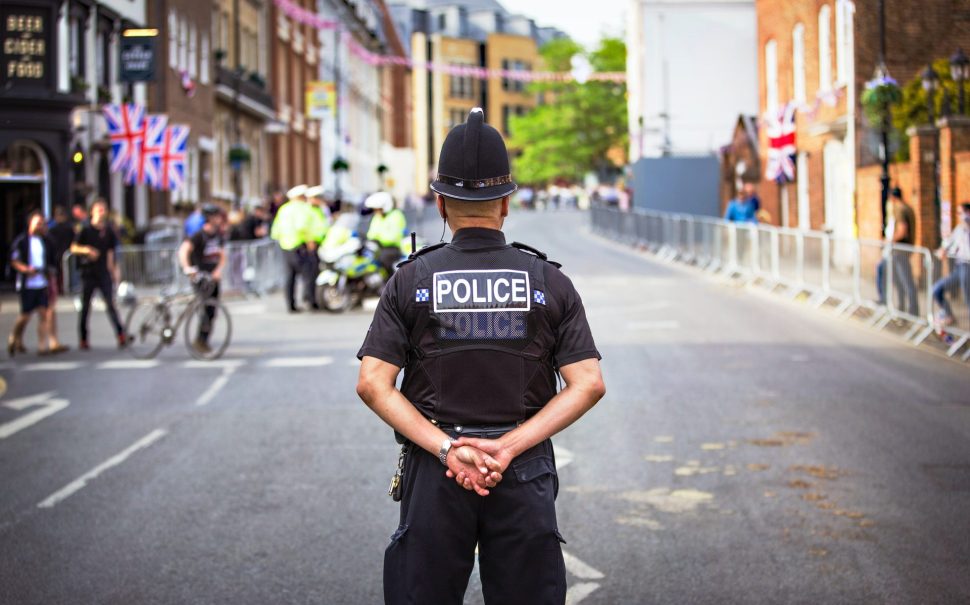 A police officer stood in a street