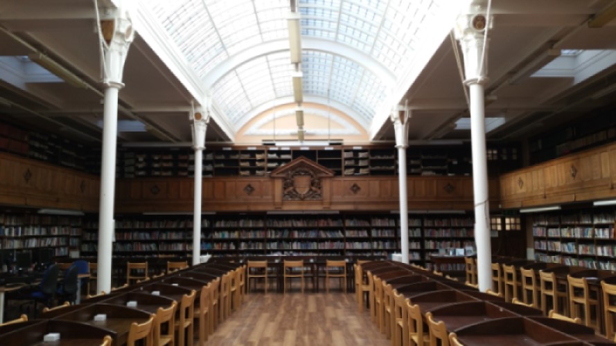 The interior of Battersea library in Wandsworth. There are rows of desks and bookshelves