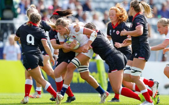 England's Zoe Aldcroft is tackled by Canadian defenders