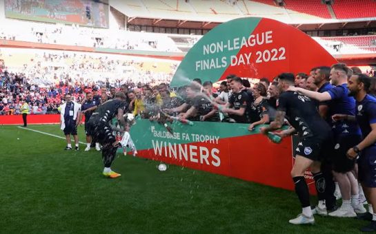 Bromley FC players celebrate lifting the FA Trophy