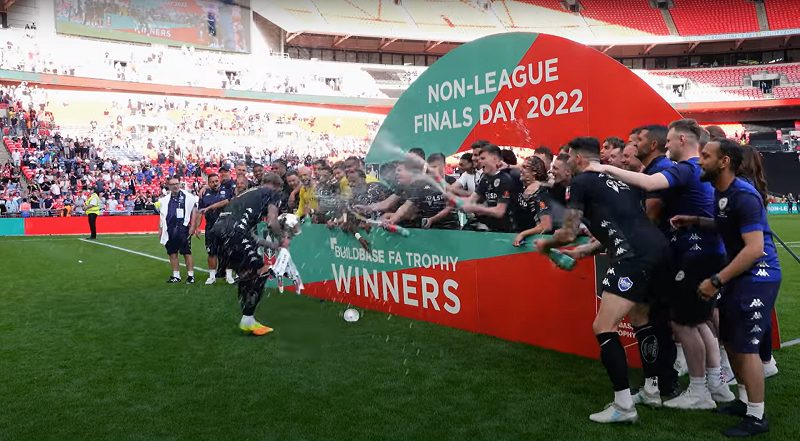 Bromley FC players celebrate lifting the FA Trophy