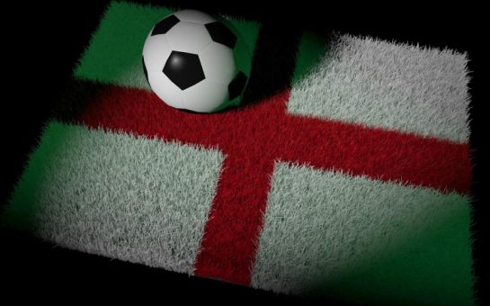 A football on an England flag lawn