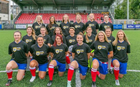 A womens football team wearing HerGameToo t-shirts