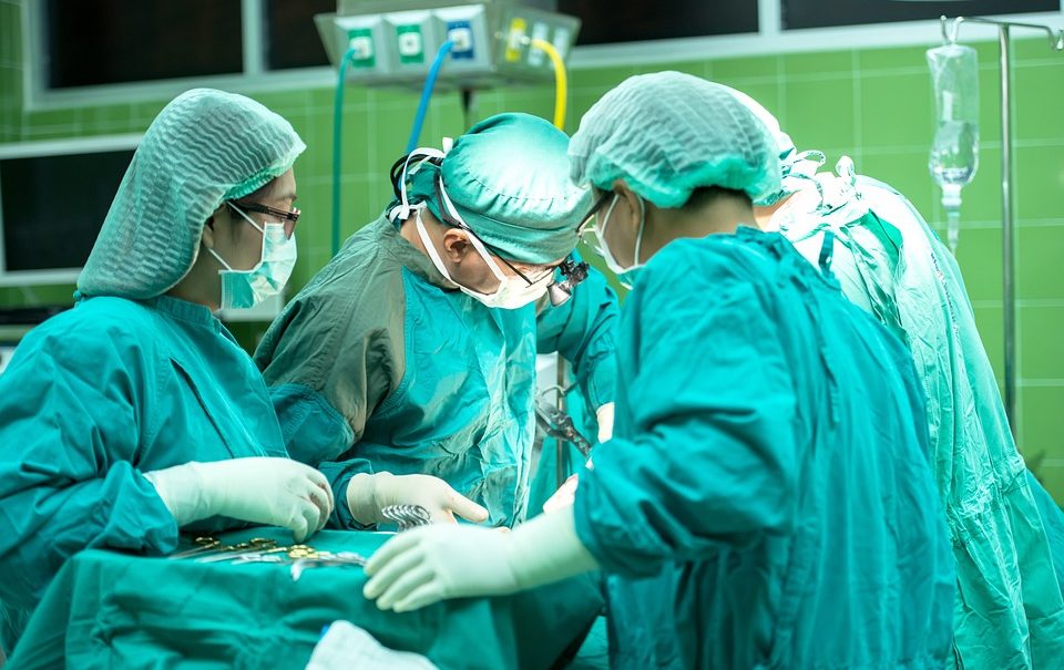 Doctors performing surgery in an operating theatre