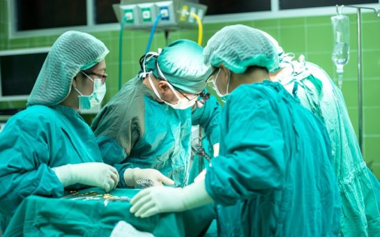 Doctors performing surgery in an operating theatre