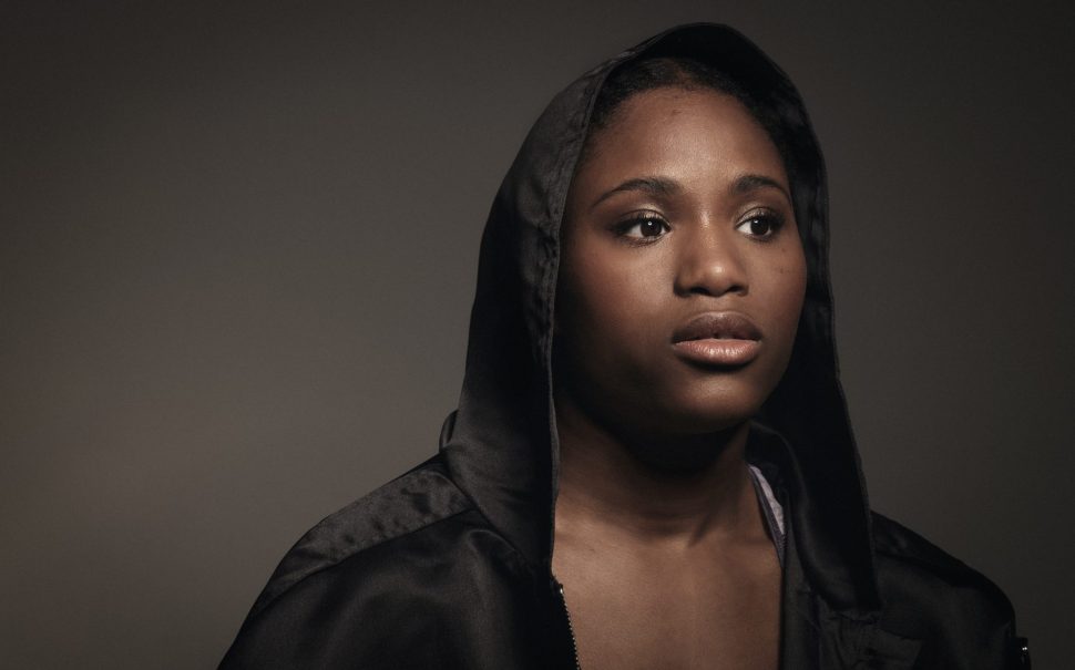 Women's professional boxer Caroline Dubois wearing a boxing robe