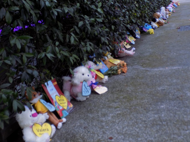 A line of toys in remembrance of young people who died in the Ukraine war this year