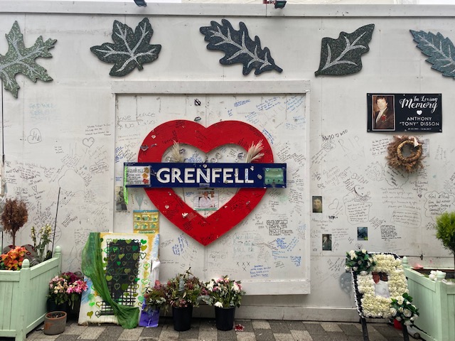 Tributes to the victims of the fire on the walls covering the area - Credit: Morgane Guillou