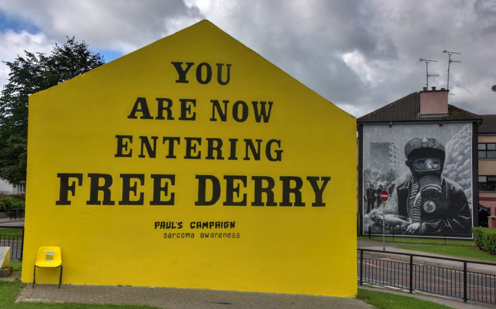 The Free Derry mural - an icon of the 'Troubles' - is repainted to reflect Norther Ireland's modern problems - a campaign to promote awareness for sarcoma cancer.