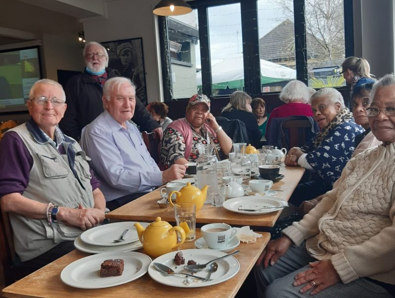 people sat in a pub eating lunch