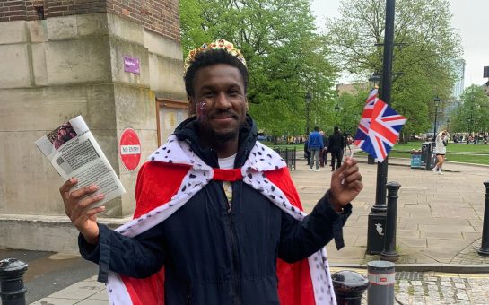 Person wearing royal-themed fancy dress in Bristol City Centre