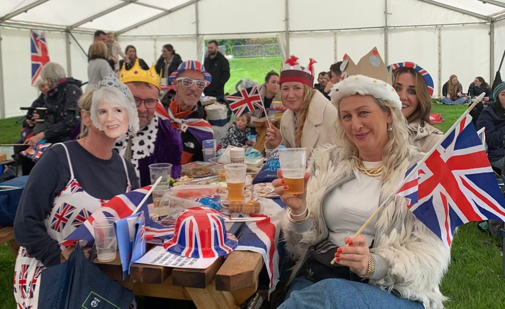 Group of friends celebrate the Coronation in fancy dress