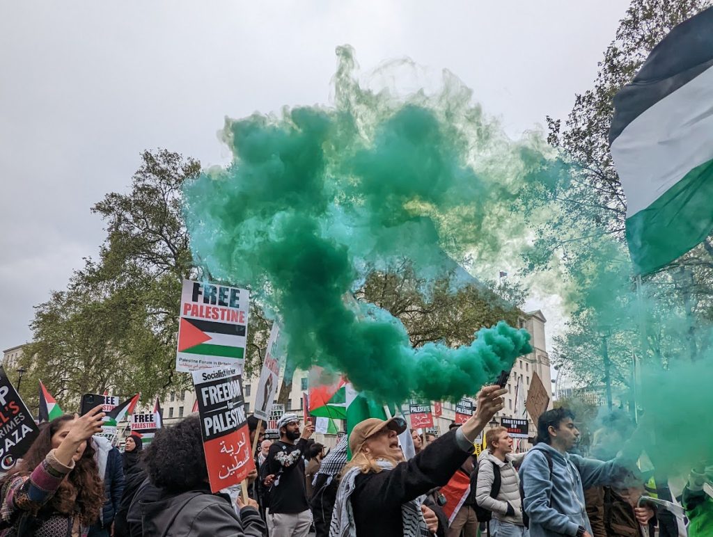 Protesters lit flares and chanted "Rishi Sunak, shame on you" for his alleged complicity in Israel's oppressive rule.