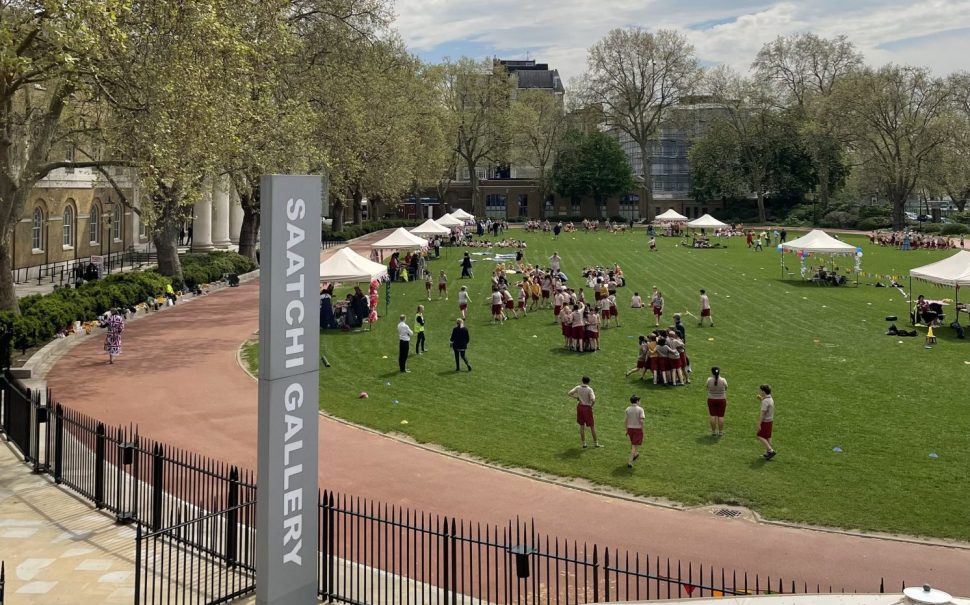 Children playing and running around on a field