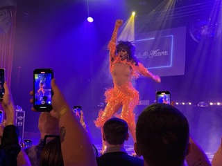 Ra'Jah O'Hara in an orange frilled catsuit at the Clapham Grand