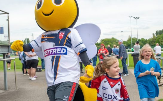 Rugbees mascot leads out the launch of the Rugbees programme