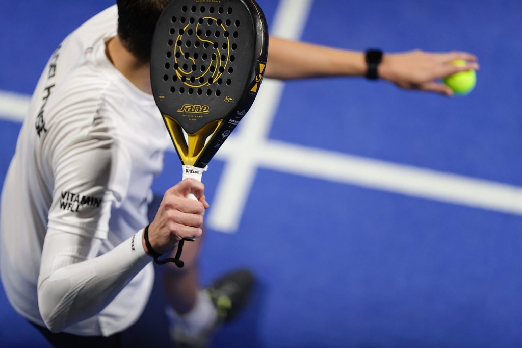 A man prepares to hit a ball with his racket. 
