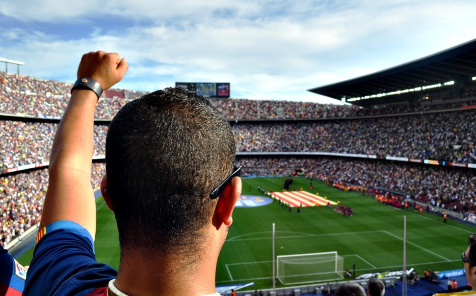 A man supporting his team in a football match