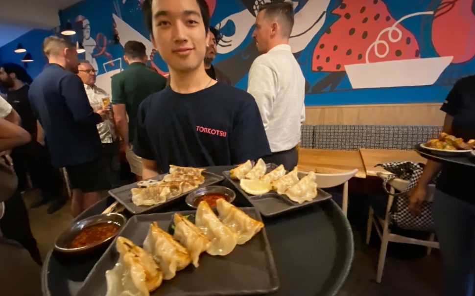 Server bringing around gyoza