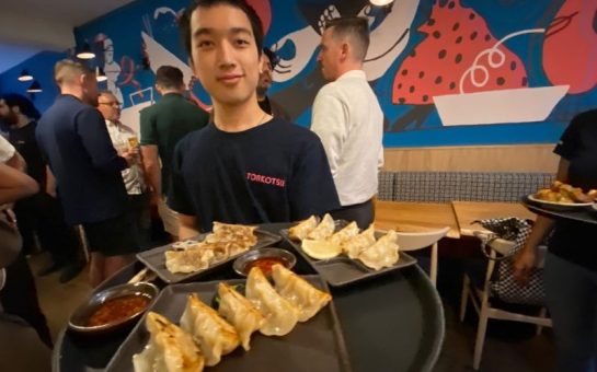 Server bringing around gyoza