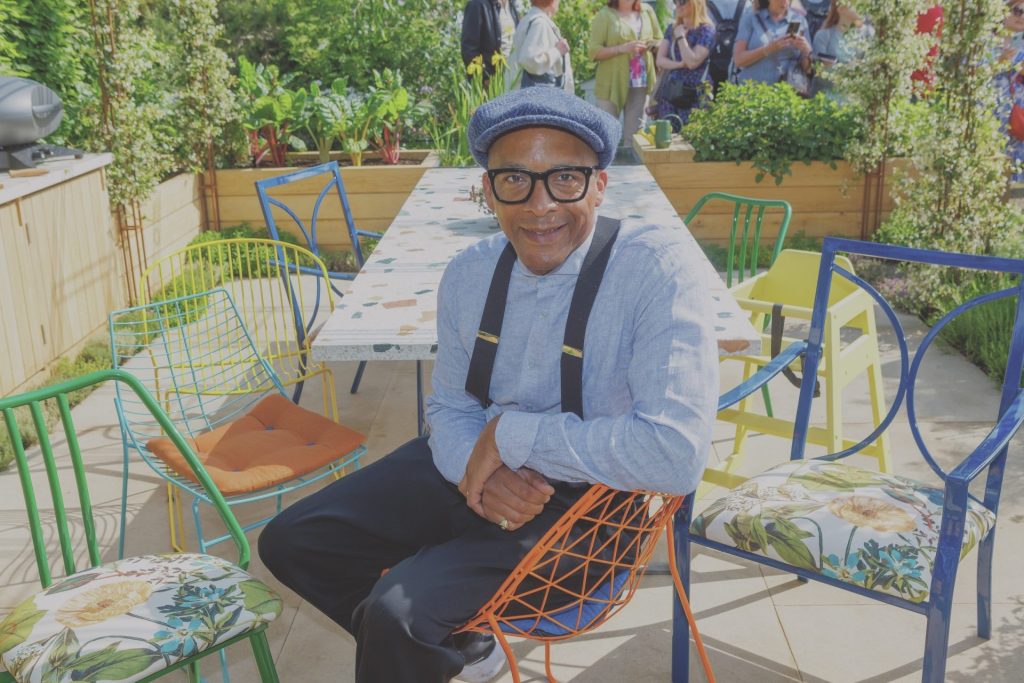 Jay Blades at the Chelsea Flower Show in May with the chairs his workshop designed for the London Square Community Garden.