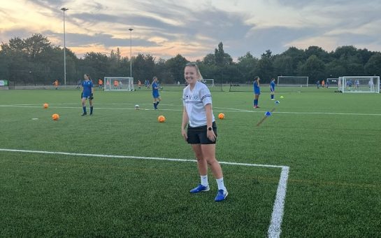 A coach at Hitchin Belles on the field