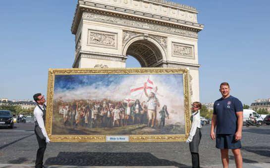 Dylan Hartley with artwork outside the Arc De Triomphe